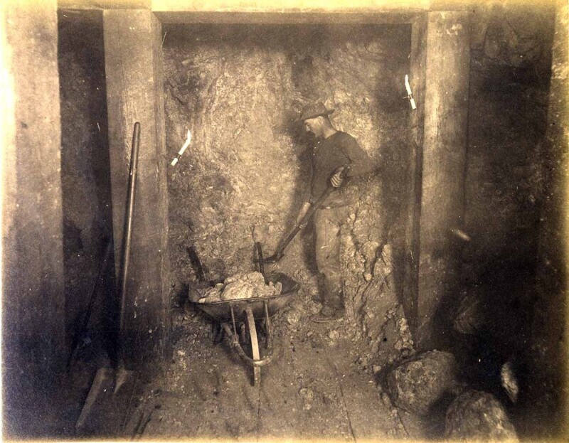 High ore 600 level West Showing miner wheeling ore to chutes Ore 10 ft