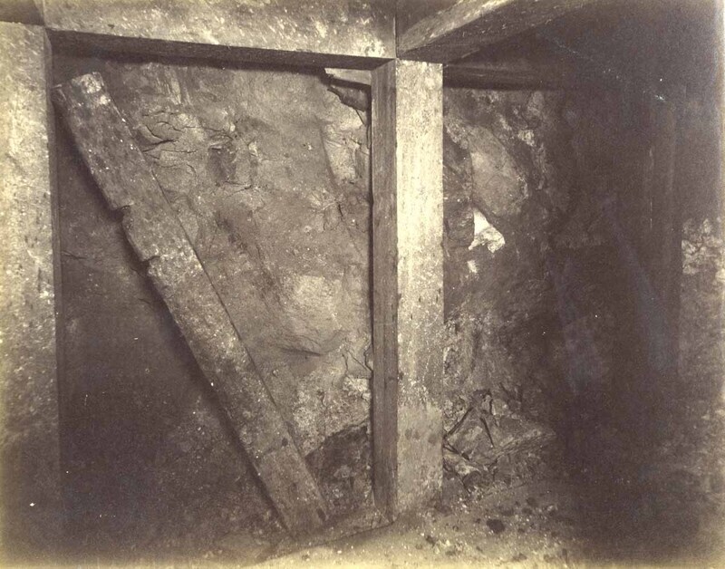 Mt Con 300 level East sill floor.  Showing ore breast closely timbered.
